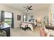 Cozy bedroom with neutral tones, two windows and comfortable furnishings, creating a relaxing retreat at 4625 Canoe Creek Ave, Parrish, FL 34219