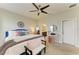 Inviting bedroom with a comfortable bed, stylish decor, and an ensuite bathroom, perfect for relaxation at 4625 Canoe Creek Ave, Parrish, FL 34219