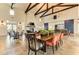 Spacious clubhouse with tall ceilings, rustic beams, fireplace, dining tables, and blue barn doors at 4625 Canoe Creek Ave, Parrish, FL 34219
