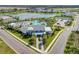 Community center with a pool, lake, tennis courts, lush landscaping, and sidewalks in the Canoe Creek neighborhood at 4625 Canoe Creek Ave, Parrish, FL 34219