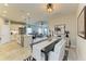 Open-concept design with a dining area flowing into a modern kitchen and living space at 4625 Canoe Creek Ave, Parrish, FL 34219