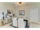 Elegant dining area featuring a modern light fixture and sideboard at 4625 Canoe Creek Ave, Parrish, FL 34219