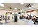 Well-equipped gym featuring modern fitness machines, ceiling fans, and ample space for a complete workout at 4625 Canoe Creek Ave, Parrish, FL 34219
