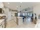 Spacious kitchen featuring white cabinets, stainless steel appliances, and an island with bar seating at 4625 Canoe Creek Ave, Parrish, FL 34219