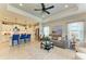 Living room showcases an open layout with kitchen, comfortable seating, and stylish decor, perfect for modern living at 4625 Canoe Creek Ave, Parrish, FL 34219