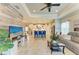 Open-concept living room with modern decor, leading to a well-equipped kitchen and dining area at 4625 Canoe Creek Ave, Parrish, FL 34219