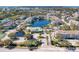 Extensive aerial view of the neighborhood showcasing the community pool, lake, and surrounding residences at 4802 51St W St # 808, Bradenton, FL 34210