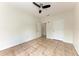 Bedroom with tile flooring, ceiling fan, and a doorway at 4802 51St W St # 808, Bradenton, FL 34210