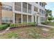 Inviting condo building with screened porches and lush landscaping offering a relaxed and comfortable living environment at 4802 51St W St # 808, Bradenton, FL 34210