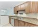Modern kitchen with granite countertops, stainless steel appliances, and ample cabinet space at 4802 51St W St # 808, Bradenton, FL 34210