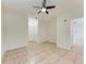 Bright living room featuring tile floors, ceiling fan, and white doors at 4802 51St W St # 808, Bradenton, FL 34210