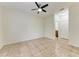 Bright room with tile flooring, a ceiling fan, and a view into an adjacent room at 4802 51St W St # 808, Bradenton, FL 34210