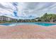 Inviting community pool with brick surround and manicured landscaping at 4802 51St W St # 808, Bradenton, FL 34210