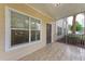 Relaxing screened porch with tiled floor, offering fresh air and natural light at 4802 51St W St # 808, Bradenton, FL 34210