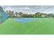 Blue and green tennis courts surrounded by trees and landscaping at 4802 51St W St # 808, Bradenton, FL 34210