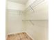 Walk-in closet featuring wire shelving and tile flooring at 4802 51St W St # 808, Bradenton, FL 34210