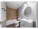 Clean bathroom featuring bathtub, tiled walk-in shower, and vanity with drawers at 496 Fletcher St, Port Charlotte, FL 33954