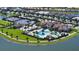 Beautiful community featuring a resort-style pool, tennis courts, clubhouse, and scenic lake views from above at 5187 Barnett Cir, Bradenton, FL 34211