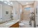 Bathroom featuring granite countertop vanity and a shower-tub combination at 5187 Barnett Cir, Bradenton, FL 34211