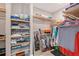 Walk-in closet with built-in shelving and ample storage space at 5187 Barnett Cir, Lakewood Ranch, FL 34211
