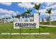 Cresswind Lakewood Ranch community sign with manicured landscaping, palm trees, and sunny skies at 5187 Barnett Cir, Lakewood Ranch, FL 34211