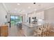 Bright kitchen featuring granite countertops, stainless steel appliances, and scenic backyard views at 5187 Barnett Cir, Lakewood Ranch, FL 34211