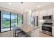 Bright kitchen featuring granite countertops, stainless steel appliances, and a beautiful view at 5187 Barnett Cir, Lakewood Ranch, FL 34211