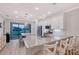Gourmet kitchen with granite countertops, stainless steel appliances, and views of the water at 5187 Barnett Cir, Lakewood Ranch, FL 34211
