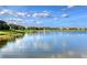 A serene lake view showcases the community's fountain, landscaping, and surrounding homes at 5187 Barnett Cir, Lakewood Ranch, FL 34211