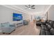 Living room featuring recessed lighting, tray ceilings, and hardwood floors at 5187 Barnett Cir, Bradenton, FL 34211