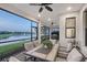 Inviting outdoor patio with comfortable seating and a serene water view, perfect for relaxing and entertaining guests at 5187 Barnett Cir, Lakewood Ranch, FL 34211