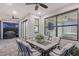 Comfortable patio with seating, views to bedroom, ceiling fan, and outdoor dining set at 5187 Barnett Cir, Lakewood Ranch, FL 34211