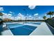 Outdoor pickleball courts with blue and gray surfaces and lighting for evening play at 5187 Barnett Cir, Lakewood Ranch, FL 34211