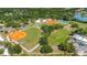 Community aerial view showcasing baseball fields, tennis courts, and green spaces at 5192 Cedar Hammock Ln, Sarasota, FL 34232
