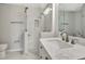 Bright bathroom featuring tile shower, vanity with marble countertop, and modern fixtures at 5192 Cedar Hammock Ln, Sarasota, FL 34232