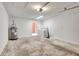 Spacious garage featuring a water heater, washer and dryer, with an orange door at 5192 Cedar Hammock Ln, Sarasota, FL 34232