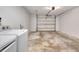 Large garage with washer and dryer and concrete floor, ready for cars or storage at 5192 Cedar Hammock Ln, Sarasota, FL 34232