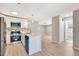 Bright kitchen features stainless steel appliances, breakfast bar, and a blue dishwasher and microwave at 5192 Cedar Hammock Ln, Sarasota, FL 34232