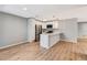 A bright kitchen features modern stainless steel appliances, pendant lighting, and an island at 5192 Cedar Hammock Ln, Sarasota, FL 34232