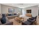 Cozy living room features a large sectional couch, plush rug, and a mounted television at 5192 Cedar Hammock Ln, Sarasota, FL 34232