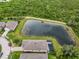 Aerial view showing a backyard pond that enhances this property's beauty and desirability at 5240 Bentgrass Way, Bradenton, FL 34211