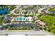 Aerial view of the community with resort style pool, playground, parking, and surrounding homes and ponds at 5240 Bentgrass Way, Bradenton, FL 34211