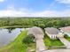 A captivating aerial view showcasing a house nestled on a picturesque lake at 5240 Bentgrass Way, Bradenton, FL 34211