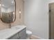 Modern bathroom featuring a vessel sink, decorative mirror, and glass door shower at 5240 Bentgrass Way, Bradenton, FL 34211