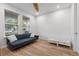 Bedroom featuring modern sofa and floors with a large window at 5240 Bentgrass Way, Bradenton, FL 34211