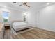 Bright bedroom with tray ceilings, modern wood-look floors, and ample natural light at 5240 Bentgrass Way, Bradenton, FL 34211