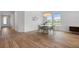 Open-concept floor plan featuring the dining area with views of the lake at 5240 Bentgrass Way, Bradenton, FL 34211