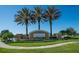 Welcome to Harmony at Lakewood Ranch community sign with tropical landscaping and clear blue skies at 5240 Bentgrass Way, Bradenton, FL 34211