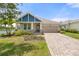 Charming single-Gathering home with a brick driveway and manicured lawn, ideal for suburban living at 5240 Bentgrass Way, Bradenton, FL 34211