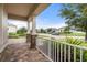 Charming front porch featuring stone pillars and a view of the neighborhood street at 5240 Bentgrass Way, Bradenton, FL 34211